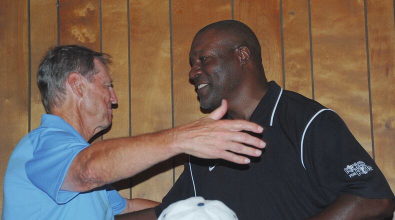 Pro Football Hall of Famer Dick LeBeau, left, greets former Cincinnati Bengal David Fulcher during the 2015 Dick LeBeau Legends Golf Classic at Mitchell Hills Club. LeBeau will return along with several other retired professional athletes for a tournament and special dinner fundraiser on July 15 at Mitchell Hills. The public can purchase tickets for the dinner for $20. CONTRIBUTED