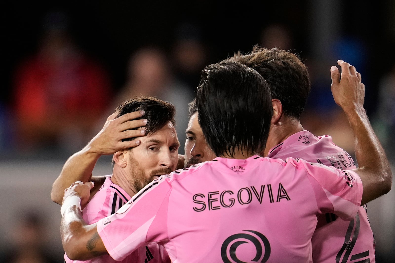 Inter Miami midfielder Lionel Messi, left, celebrates with teammates after a goal by forward Tadeo Allende, right, during the first half of an MLS soccer match against the San Jose Earthquakes, Wednesday, May 14, 2025, in San Jose, Calif. (AP Photo/Godofredo A. Vásquez)