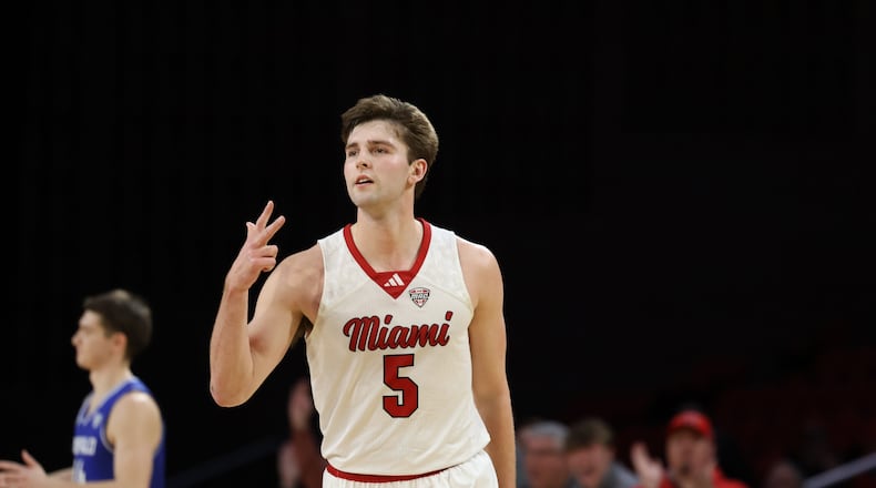 Miami’s Peter Suder celebrates after knocking down a 3-pointer against Buffalo on Saturday at Millett Hall. ELIJAH COOK / CONTRIBUTED
