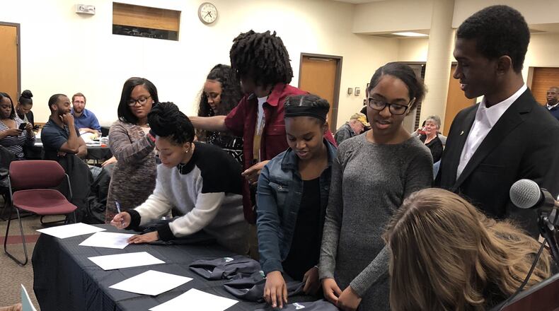 Eight area high school students signed contracts Friday to become the first Upward Bound Promise Ambassadors, a program promoted by Wittenberg University’s Upward Bound and Springfield Promise Neighborhood. Photo by Brett Turner