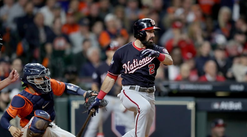 The Nationals’ Adam Eaton hits a two-run single against the Houston Astros during the ninth inning in Game Seven of the 2019 World Series at Minute Maid Park on October 30, 2019 in Houston, Texas. (Photo by Elsa/Getty Images)