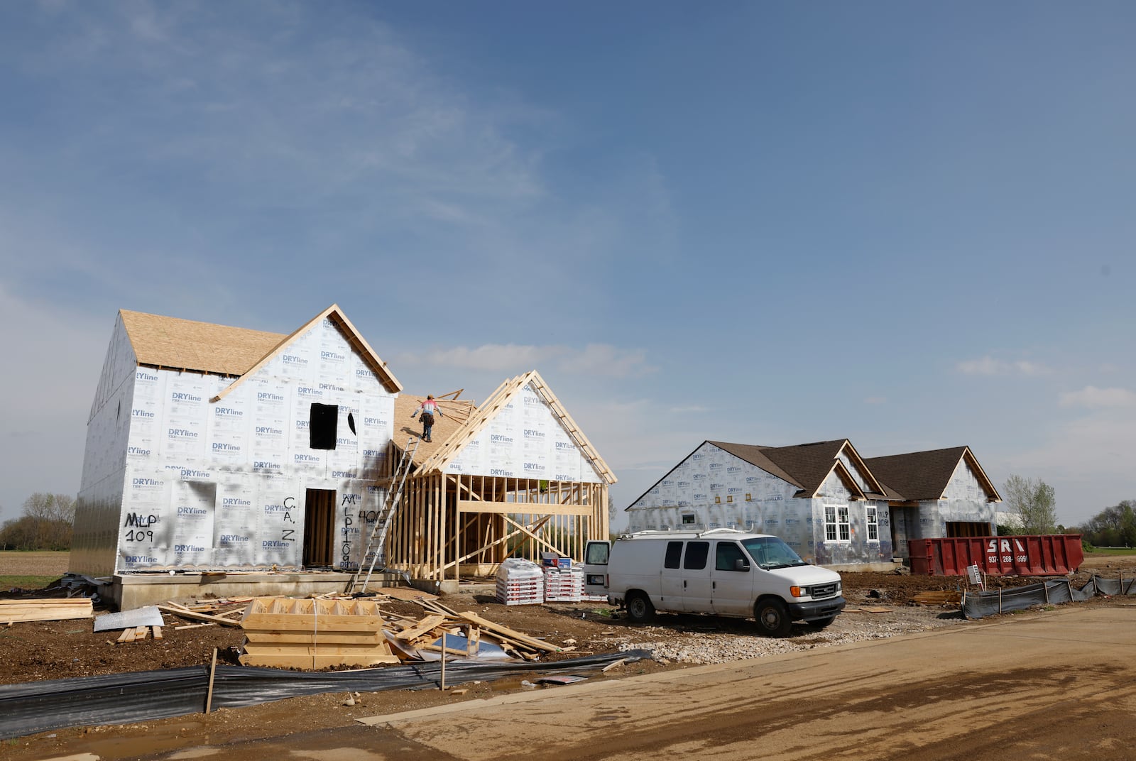 A construction worker builds a house on Tuesday, April 29, 2025, in the Fischer Homes neighborhood of Melody Parks. JOSEPH COOKE/STAFF