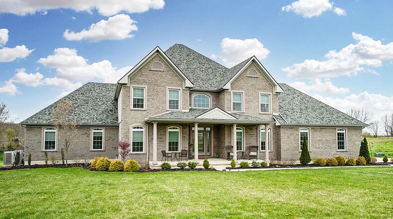 Originally built in 2017, the 2-story home offers about 9,710 sq. ft. of living space with 5 bedrooms and 3 1/2 baths. It is set on 3.83 acres and includes attached and detached garages. CONTRIBUTED PHOTO