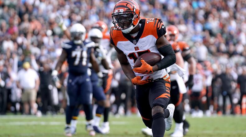 CARSON, CA - DECEMBER 09: John Ross #15 of the Cincinnati Bengals run in after his catch for a touchdown, to trail 14-12 to the Los Angeles Chargers, during the second quarter at StubHub Center on December 9, 2018 in Carson, California. (Photo by Harry How/Getty Images)