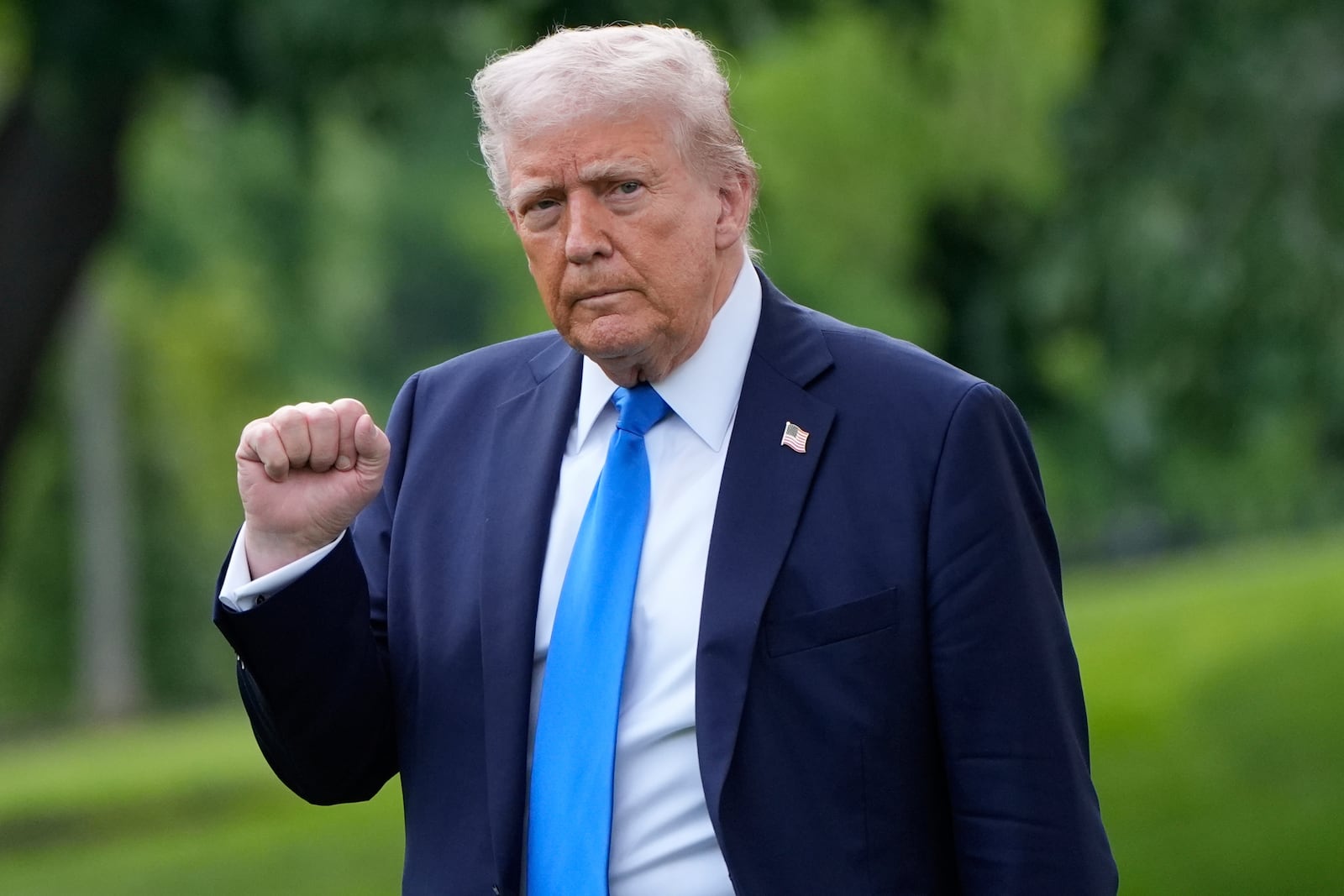 President Donald Trump gestures as he walks from the Oval Office to depart on Marine One from the South Lawn of the White House, Thursday, May 1, 2025, in Washington. (AP Photo/Alex Brandon)