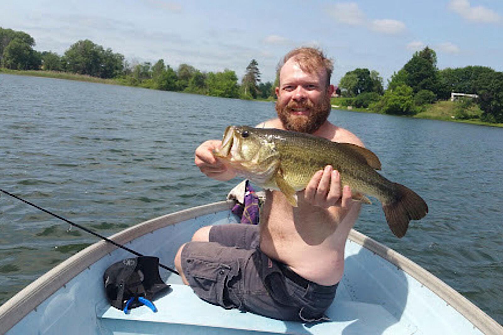 This undated image shows Chris Pelkey with a fish at Crystal Lake in Coram, N.Y. (Tim Wales via AP)