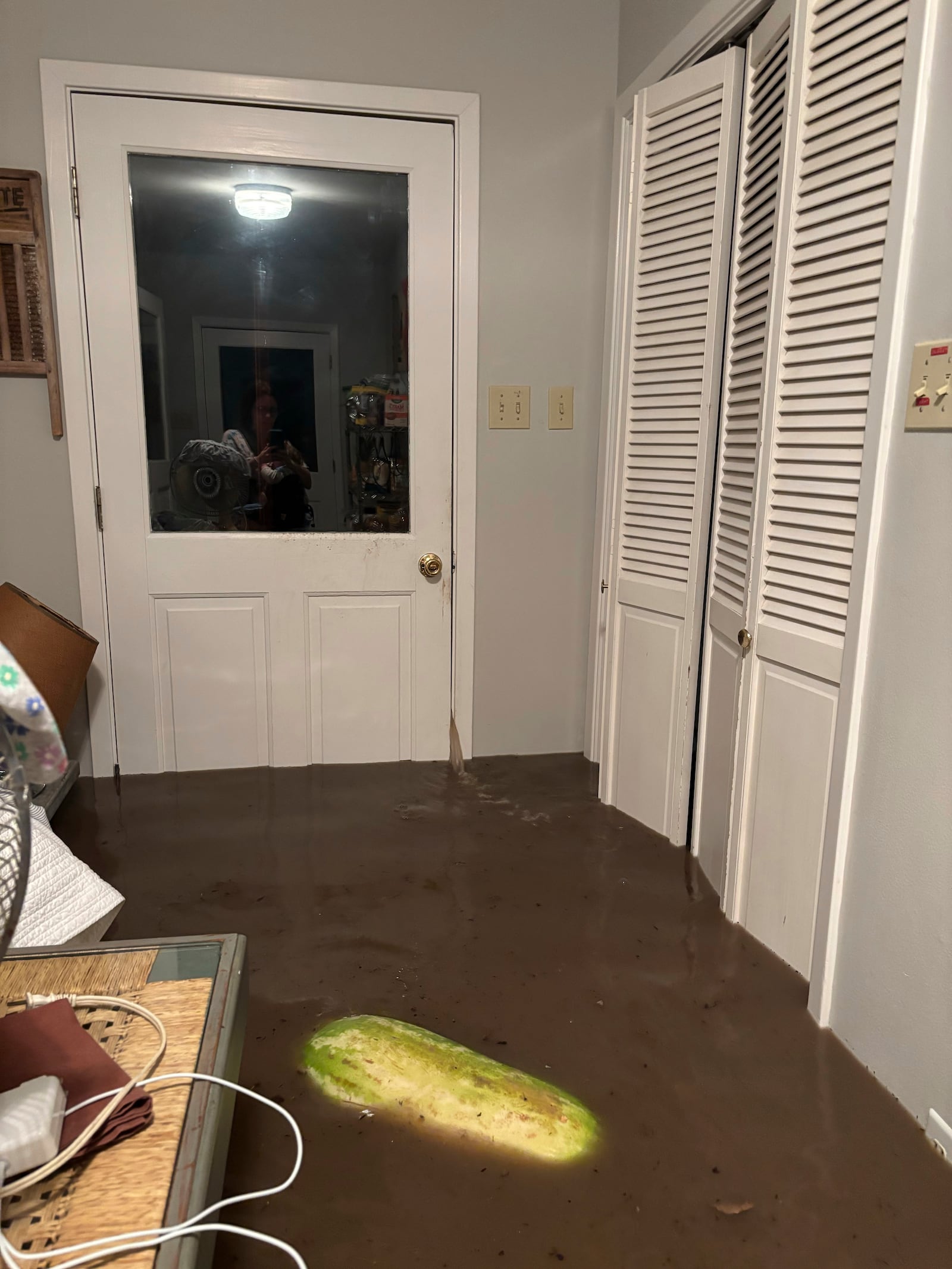 Water leaks through a door jamb in Alden Towler's cabin in Hunt, Texas, at 4:15 a.m. on Friday, July 4, 2025. (Shabd Simon-Alexander via AP)