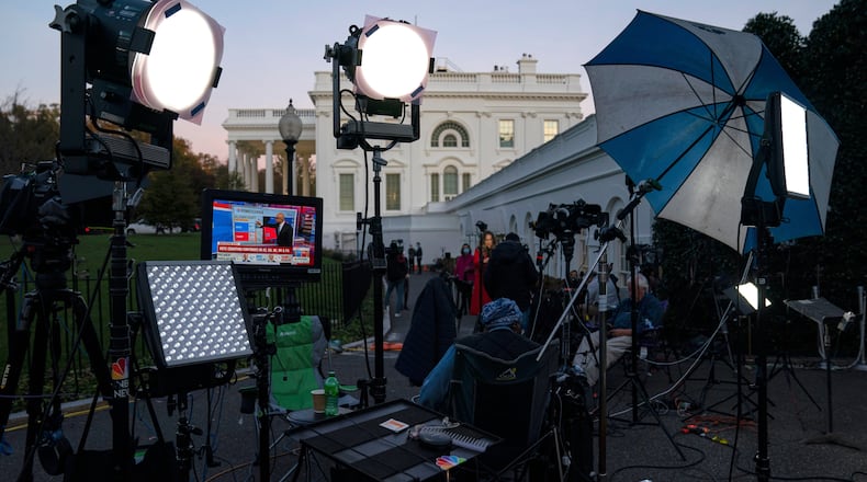FILE - A feed from the MSNBC cable news channel is pictured on a monitor as media organizations set up outside the White House, Nov. 6, 2020, in Washington. (AP Photo/Evan Vucci, File)