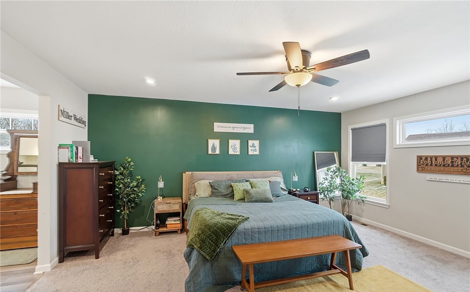 The primary bedroom suite has neutral carpeting, a ceiling fan and an ensuite bathroom. CONTRIBUTED