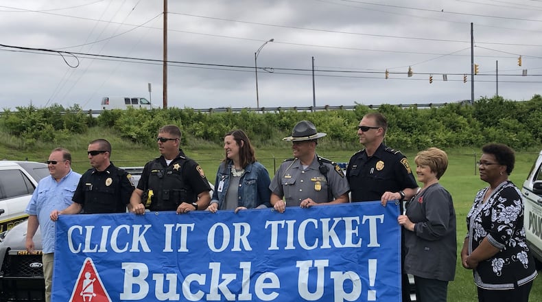 The Clark County Combined Health District will kick off this year’s Click it or Ticket national seat belt campaign with a press conference at 11 a.m. on Thursday, May 16, at 529 E. Home Road. In this file photo from a few years ago, local law enforcement and representatives of the Clark County Combined Health District and AAA Miami Valley & Northwest Ohio when they kicked off the Click It or Ticket national campaign. File/Photo by Brett Turner