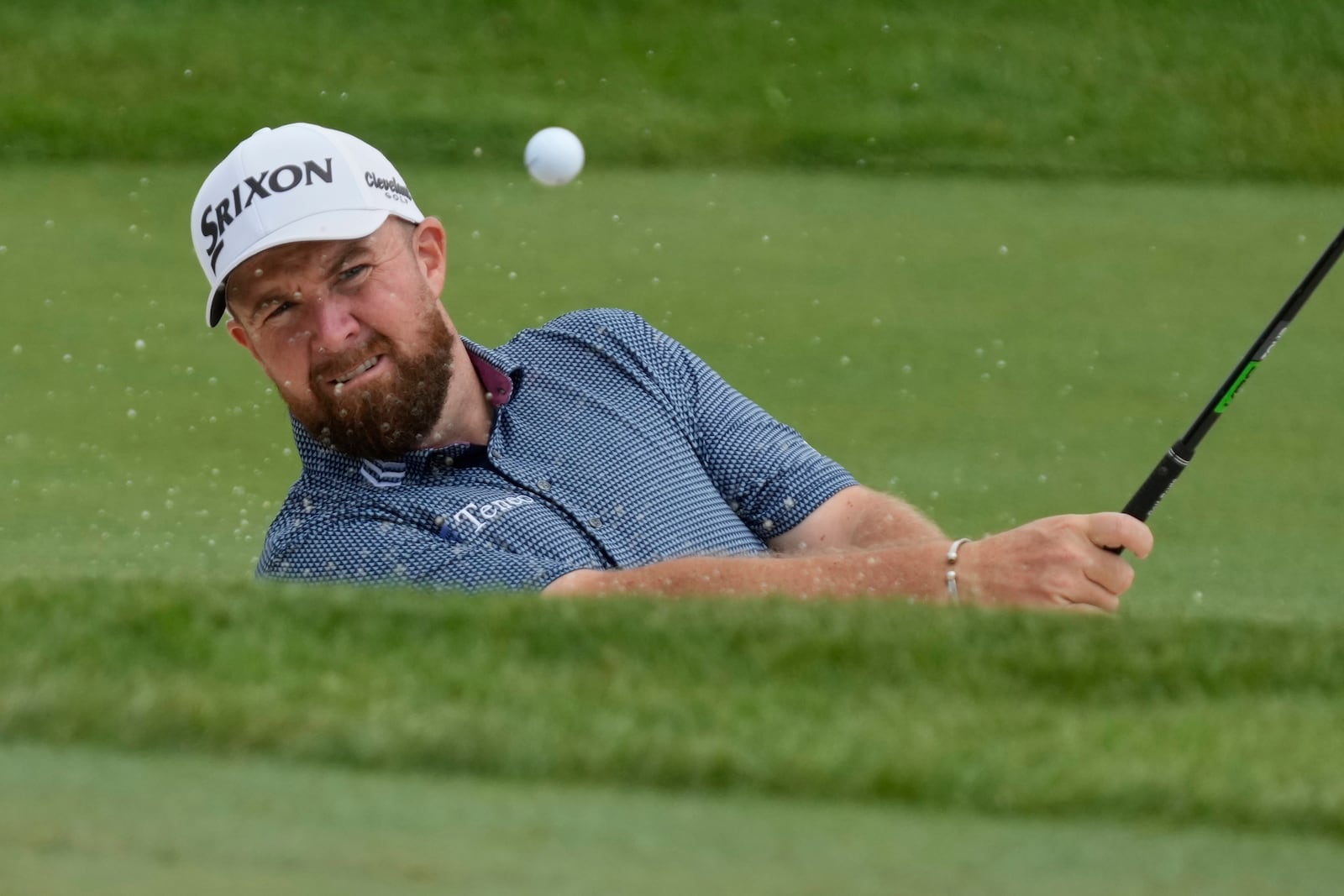 Shane Lowry hits onto the 10th green during the first round of the Memorial golf tournament Thursday, May 29, 2025, in Dublin, Ohio. (AP Photo/Sue Ogrocki)