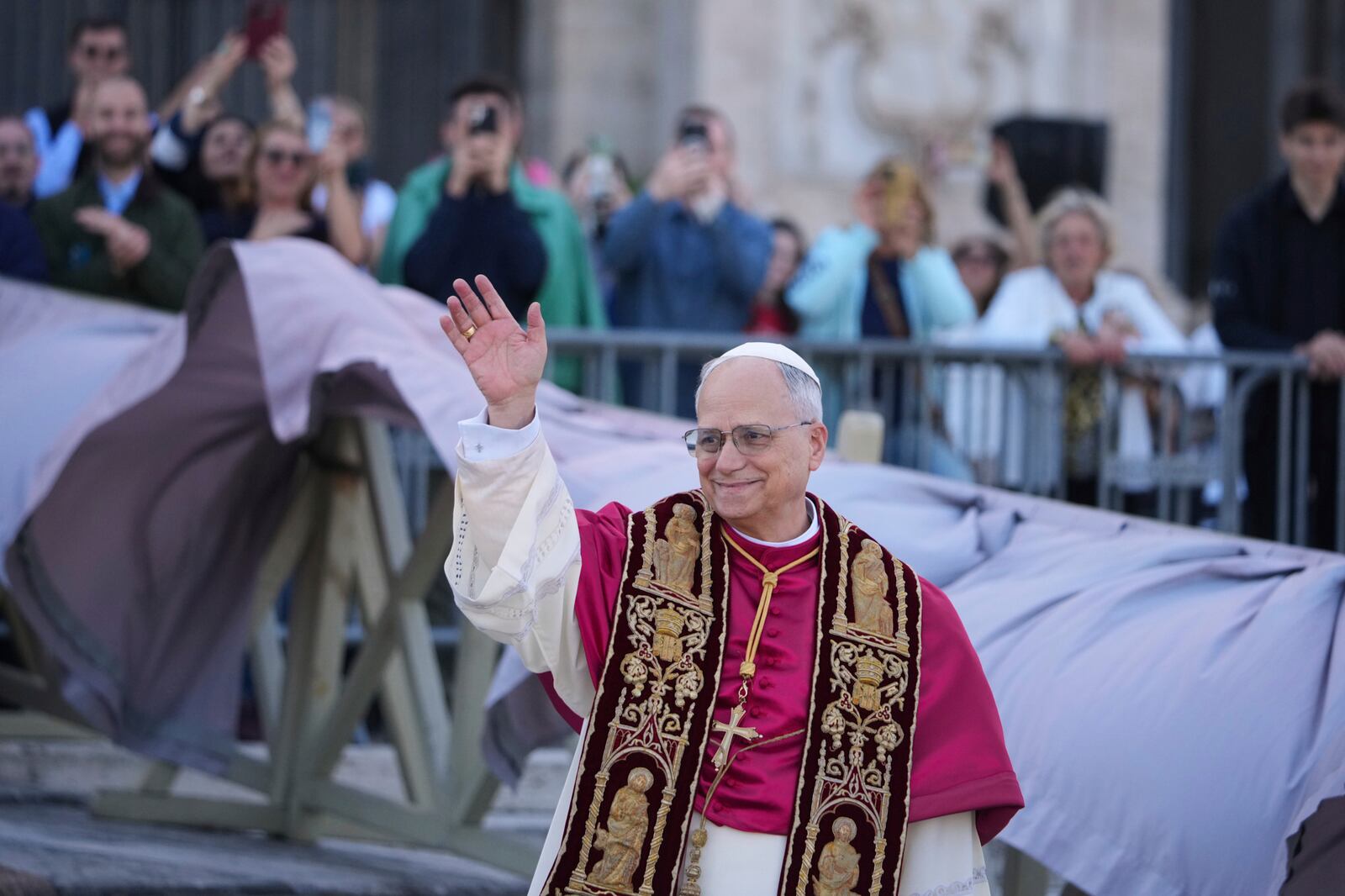 Pope Leo XIV waves upon his arrival at the Arch Basilica of St. John Lateran where he will presides over a Mass and takes possession of the Roman Cathedra, formalising his role as Bishop of Rome, in Rome, Sunday, May 25, 2025. (AP Photo/Andrew Medichini)