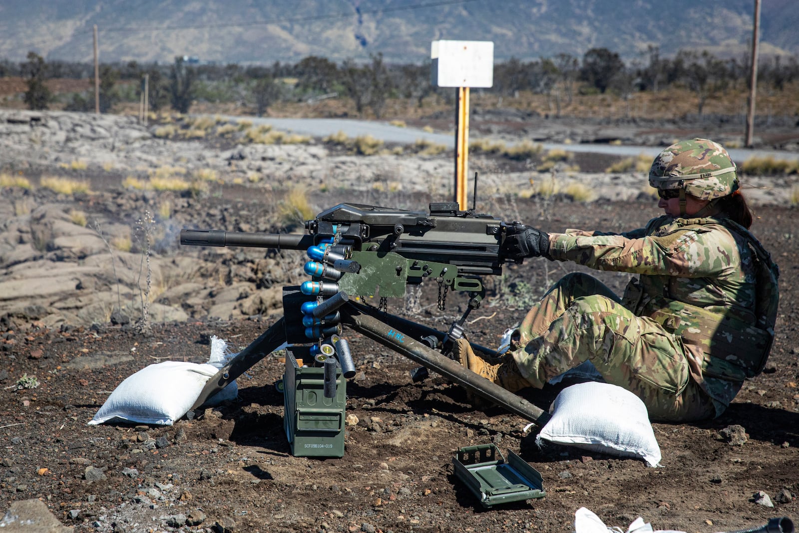 In this photo released by the U.S. Army, soldiers conduct a Mark 19, 40 mm grenade machine gun lane during Operation PIKO, the 25th Division Sustainment Brigade's annual gunnery, Feb. 1, 2025, at Pohakuloa Training Area, Hawaii. (Sgt. Jared Simmons, U.S. Army via AP)