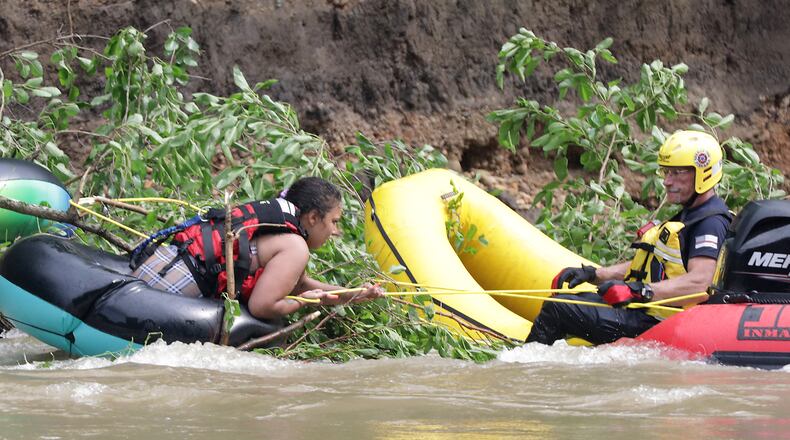 Four people had to be rescued from a fallen tree in the middle of the Mad River Monday, June 13, 2022. Fire departments from the City of Springfield, German Township and Mad River Township responded to the scene where four people had been tubing and became stranded in the swift moving water. German Township and Mad River Township used boats to rescue the victims, who were stranded between Eagle City Road and St. Paris Pike. BILL LACKEY/STAFF