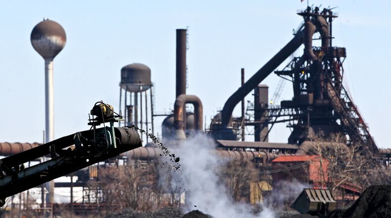 A conveyer belt transfers fuel at AK Steel in Middletown, Ohio. Middletown Works’ carbon steel melting, casting, hot and cold rolling, and finishing operations cover more than 2,791 acres. NICK DAGGY / STAFF