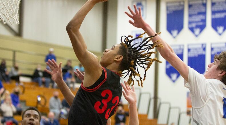 Wayne sophomore Lawrent Rice scores during the first half of Friday night's 43-39 victory at Miamisburg. Rice scored the winning basket with 4.5 seconds left. Jeff Gilbert/CONTRIBUTED