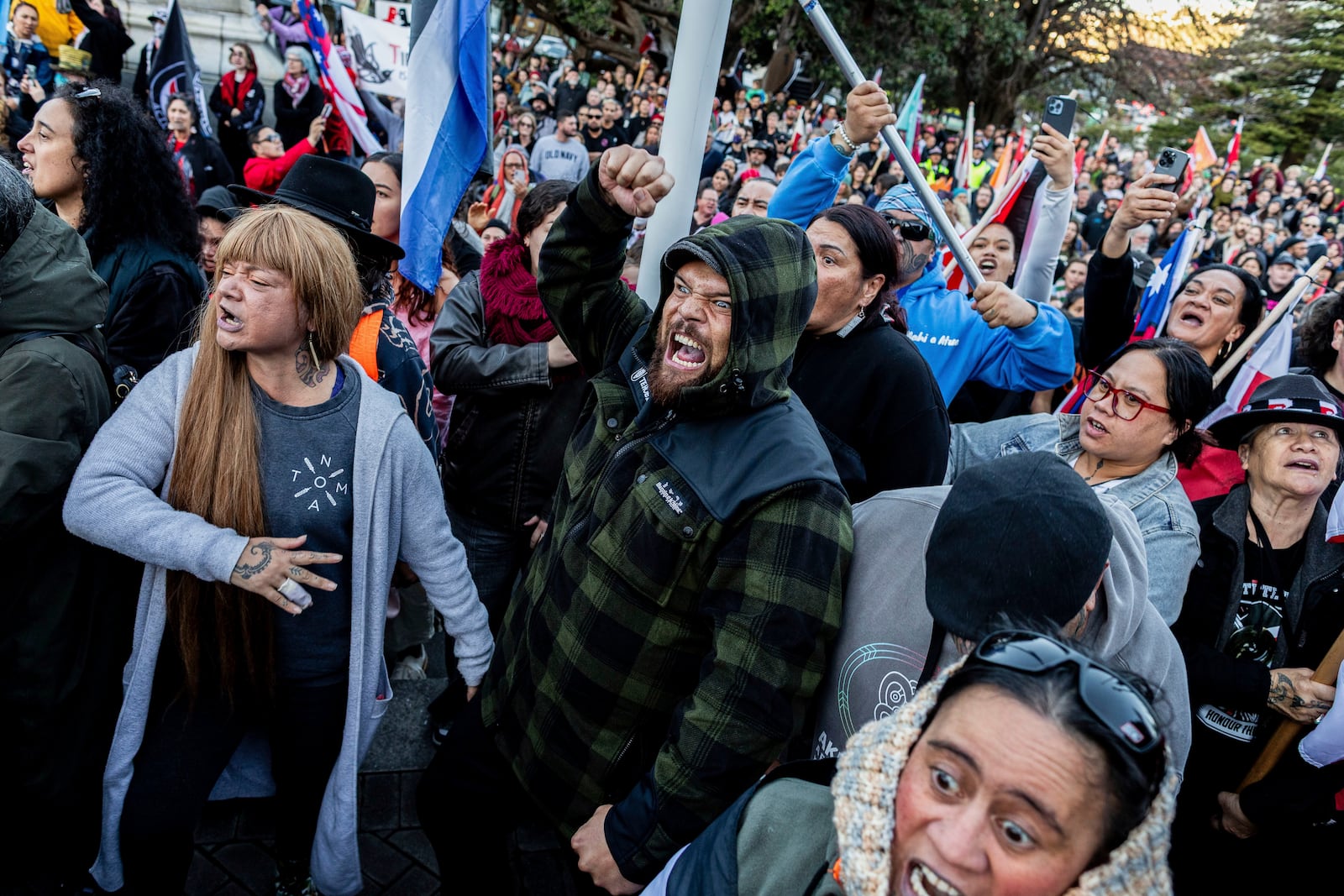 Protesters perform a haka outside parliament in Wellington, New Zealand, Tuesday, May 20, 2025. (David Unwin/Stuff via AP)