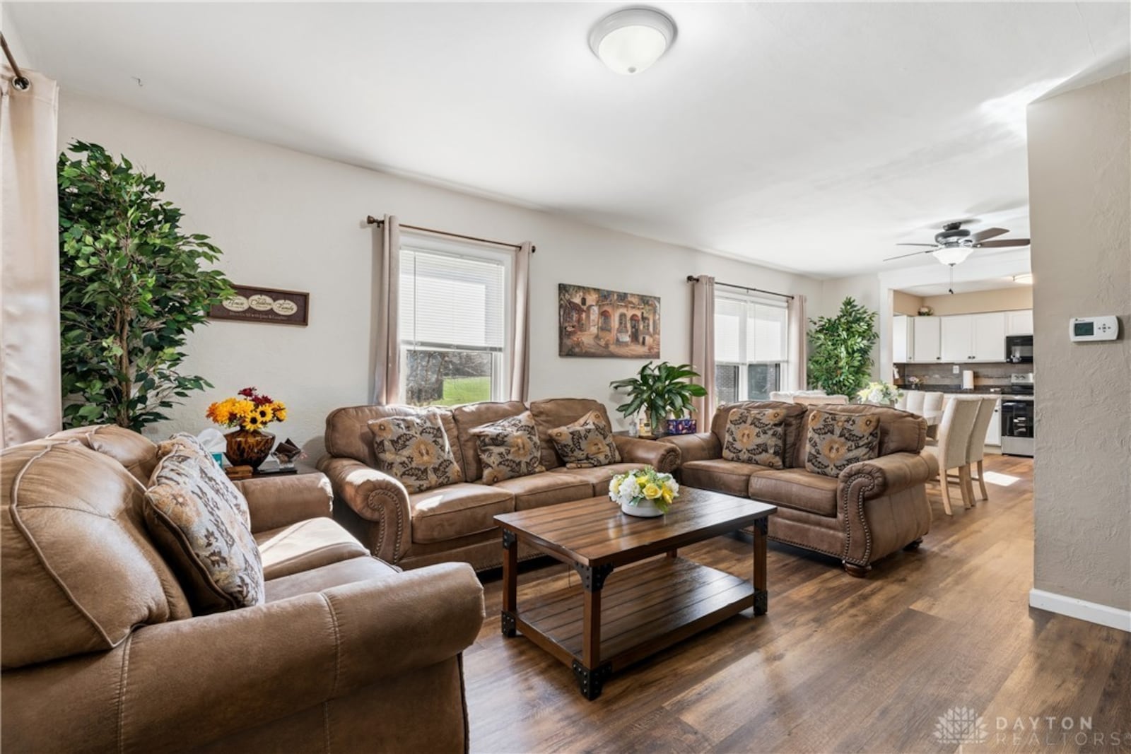 the original ranch house has been updated to include this open concept space with living and dining rooms and updated kitchen. CONTRIBUTED