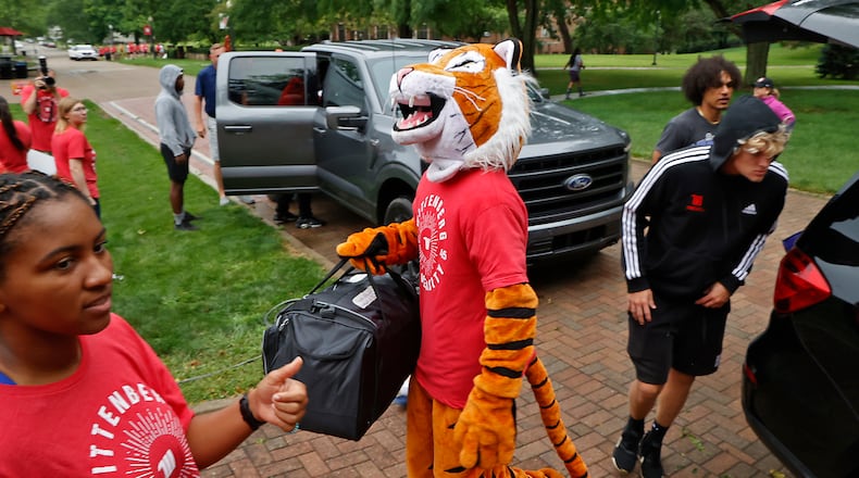 Wittenberg University’s phrase “Tiger Up” has now been trademarked by the college. In this photo, Ezry the Wittenberg Tiger mascot joined in earlier this year to help incoming freshmen move into the dorms during "Move-In Day" on campus. FILE/BILL LACKEY/STAFF