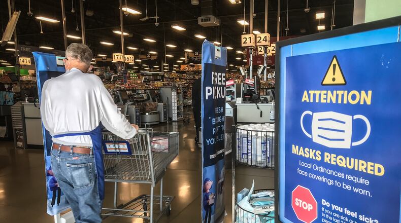 Kroger shoppers are prompted to wear masks at the entrance of the store at Springboro Pike and West Alex-Bell Rd. Monday, Nov. 16, 2020. JIM NOELKER/STAFF
