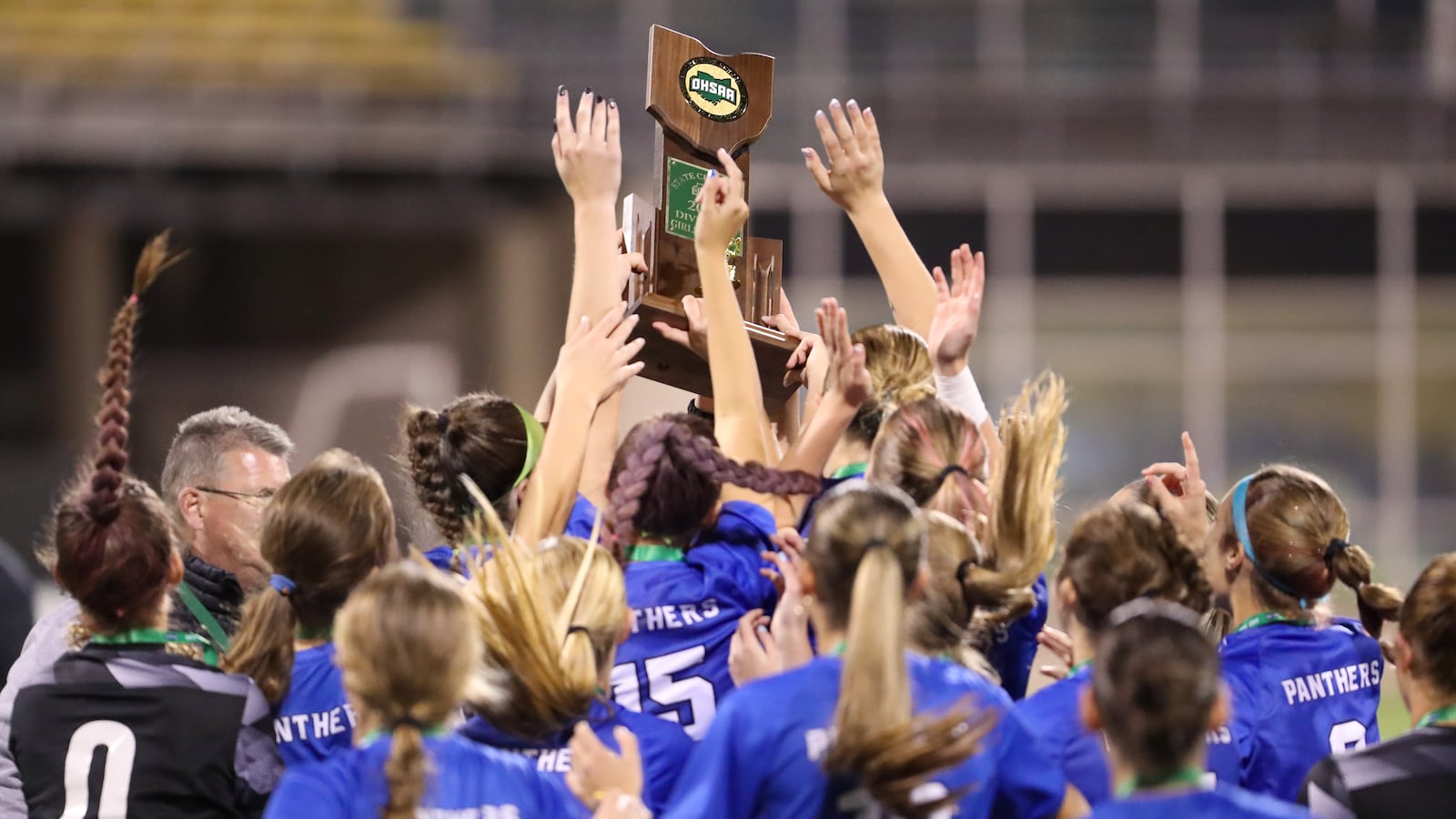 The Springboro girls soccer team hoists the trophy after defeating Cuyahoga Falls Walsh Jesuit in the Division I state championship game last November in Columbus. MICHAEL COOPER / CONTRIBUTED