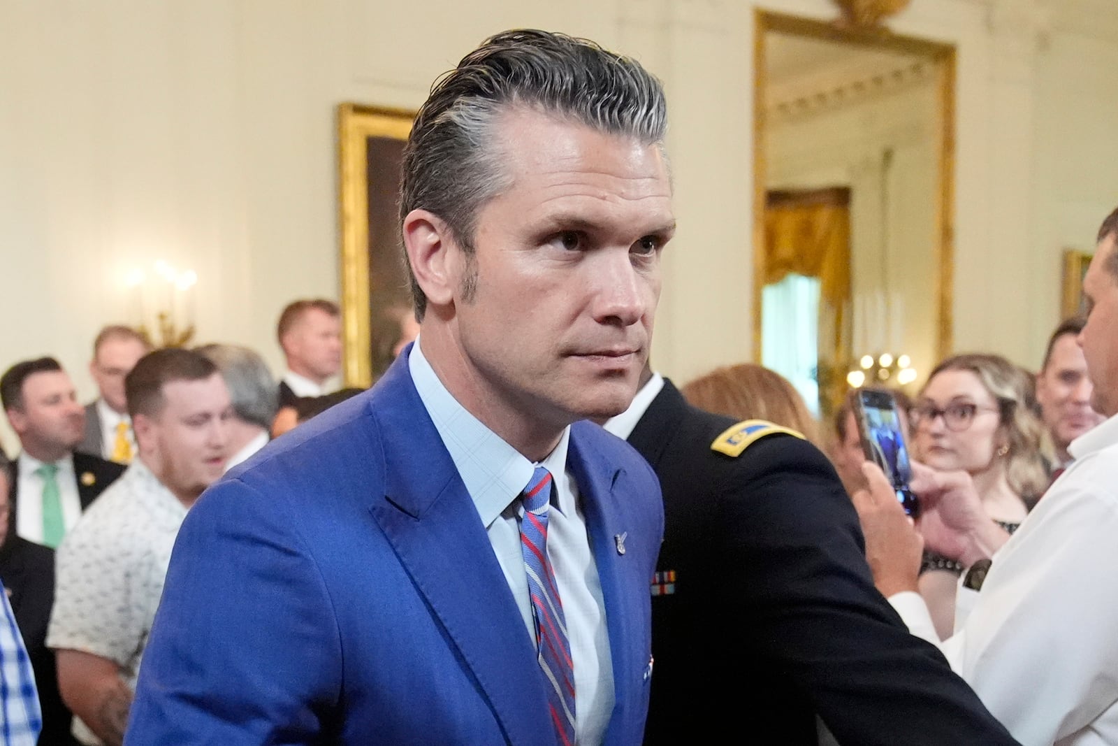 Defense Secretary Pete Hegseth departs an event to promote President Donald Trump's domestic policy and budget agenda in the East Room of the White House, Thursday, June 26, 2025, in Washington. (AP Photo/Mark Schiefelbein)