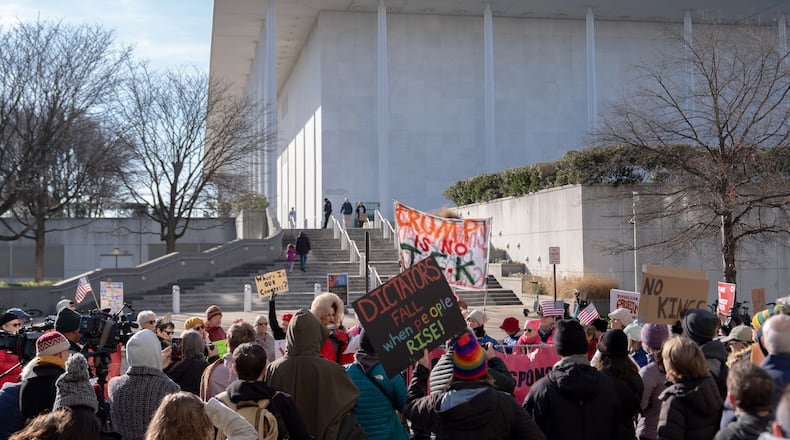 Demonstrators protest a Trump-appointed board's decision to add President Donald Trump's name to the John F. Kennedy Memorial Center for the Performing Arts, Saturday, Dec. 20, 2025, in Washington. (AP Photo/Julia Demaree Nikhinson)