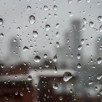 FILE PHOTO: The Dayton skyline through a rain covered window in downtown Dayton. Storms are possible tonight and Wednesday morning.