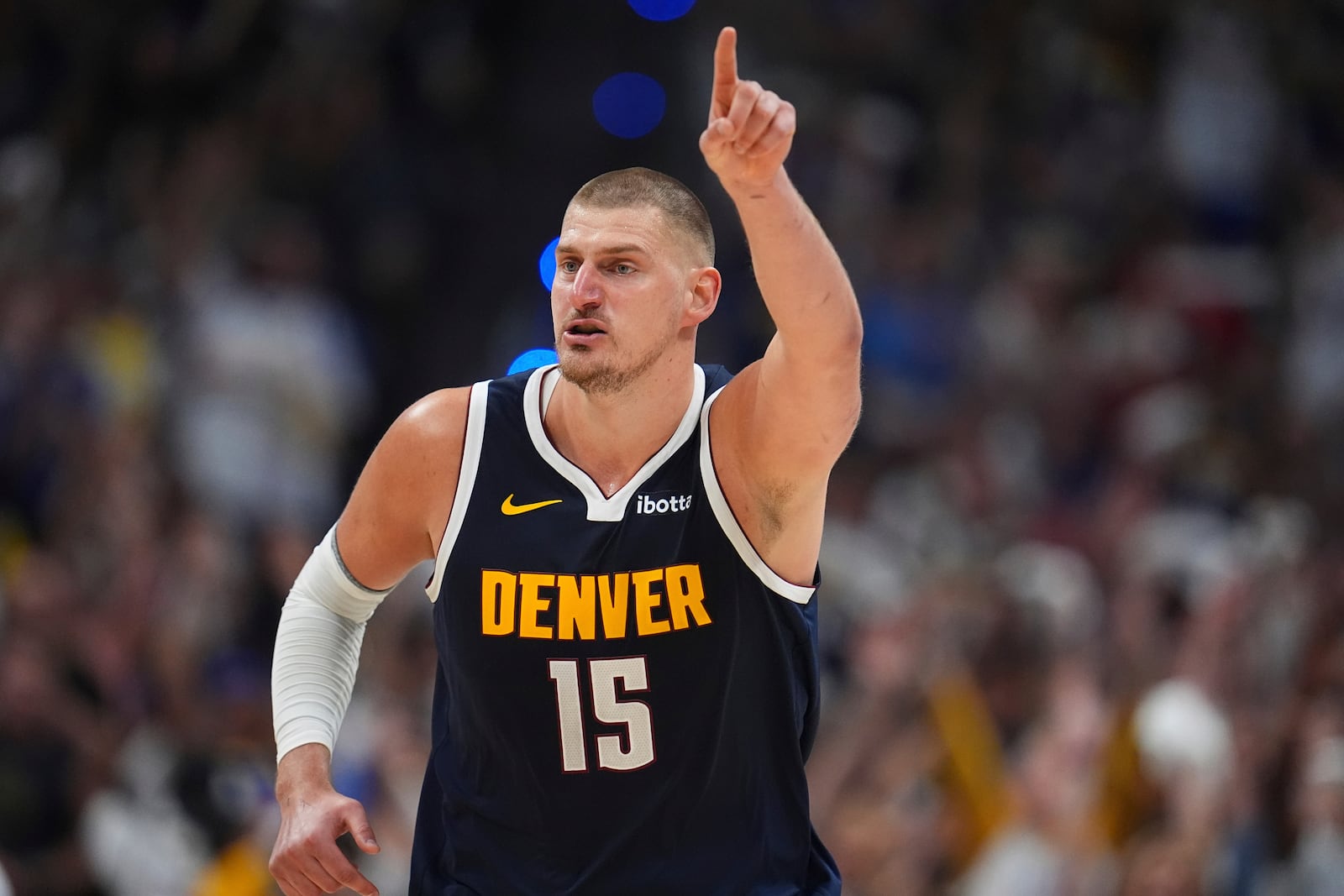 Denver Nuggets center Nikola Jokic gestures to teammates after hitting a basket against the Oklahoma City Thunder in the second half of Game 4 in the Western Conference semifinals of the NBA basketball playoffs Sunday, May 11, 2025, in Denver. (AP Photo/David Zalubowski)