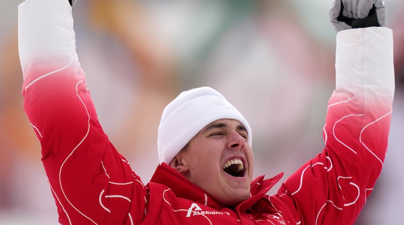Switzerland's Franjo von Allmen celebrates winning the gold medal in a men's super-G race, at the 2026 Winter Olympics, in Bormio, Italy, Wednesday, Feb.11, 2026. (AP Photo/Julia Demaree Nikhinson)