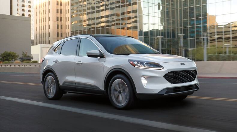This photo provided by Ford shows the Escape, a compact SUV available as a hybrid on the used market for less than $25,000. (Courtesy of Ford Motor Co. via AP)