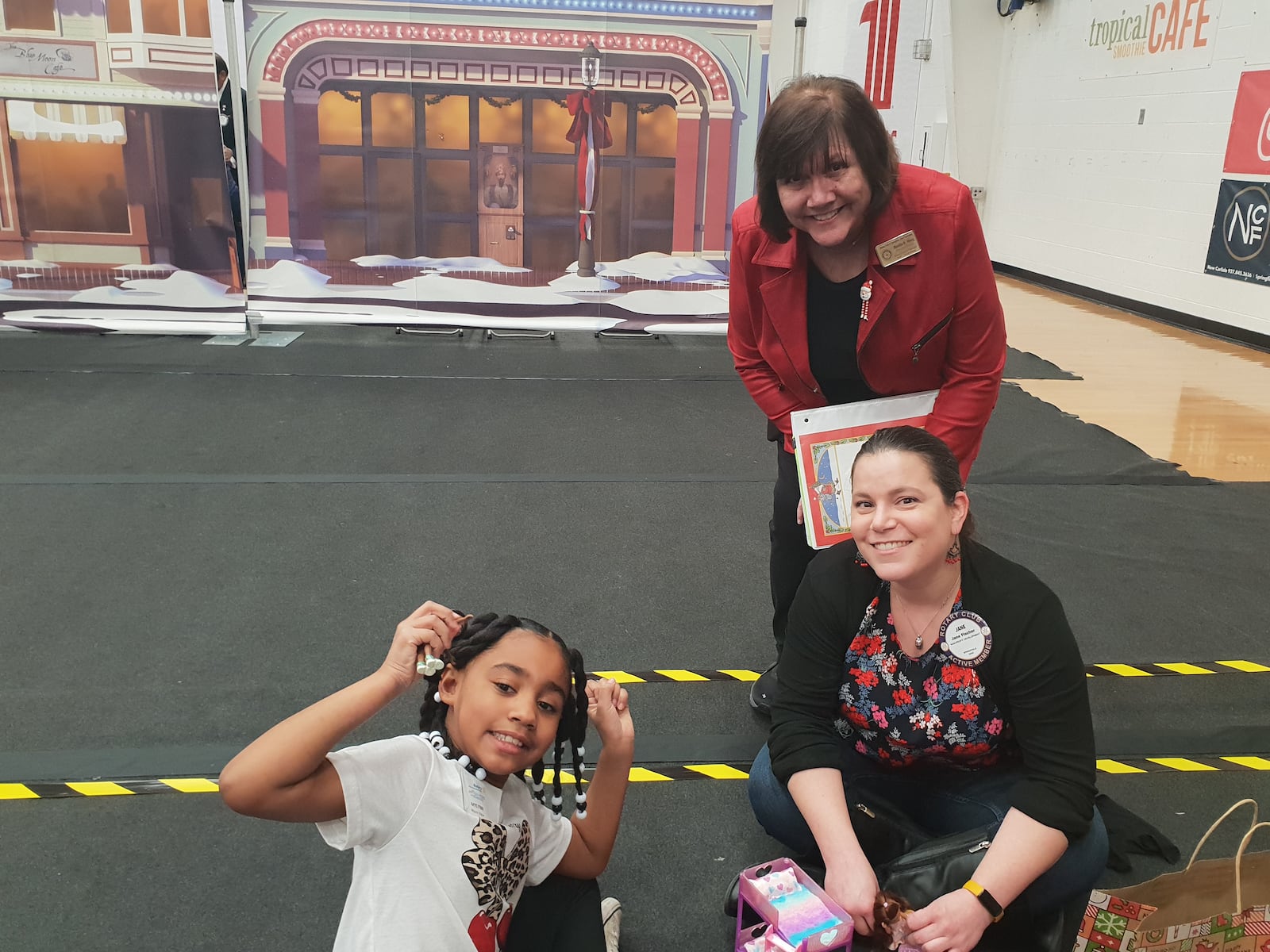 Bonita Heeg, who spends months every year organizing the Christmas Party, poses next to a child and her teacher at the Springfield Rotary's 103rd Christmas Party for Children with Disabilities on Monday, Dec. 8, 2025, at at Wittenberg University. CONTRIBUTED