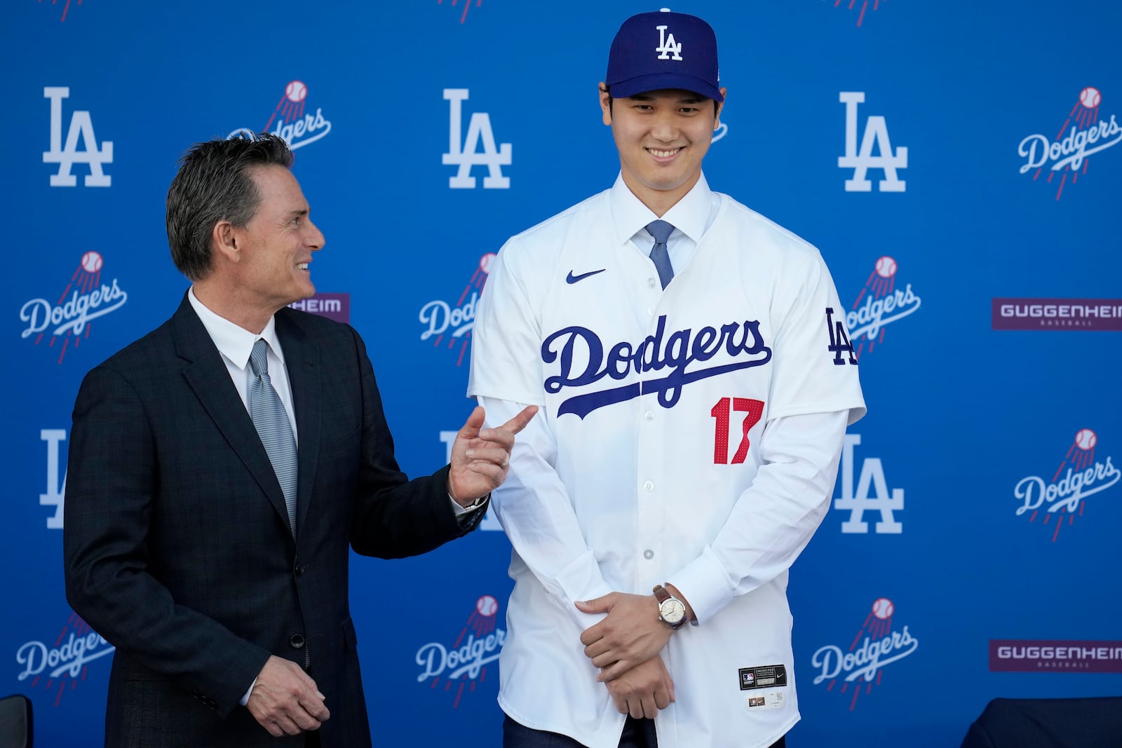 FILE - Los Angeles Dodgers' Shohei Ohtani, right, stands for photos next to agent Nez Balelo during a baseball news conference at Dodger Stadium Thursday, Dec. 14, 2023, in Los Angeles. (AP Photo/Ashley Landis, File)