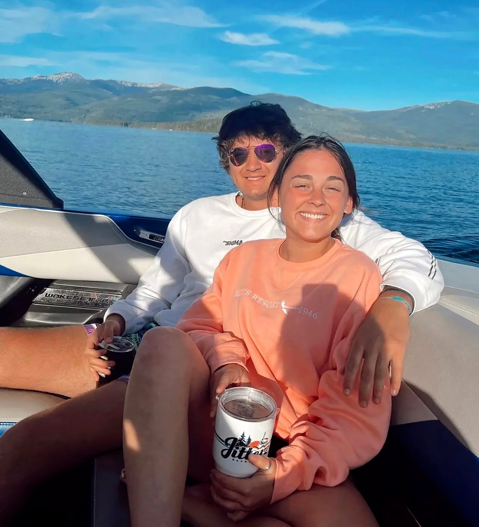 This July 2022 photo provided by Jazzmin Kernodle shows University of Idaho students Xana Kernodle, right, and Ethan Chapin on a boat on Priest Lake, in Idaho. Both students were among four found stabbed to death in an off-campus rental home on Nov. 13. (Jazzmin Kernodle via AP)