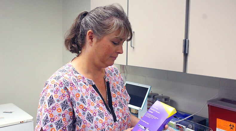 Clark County Combined Health District RN Patricia Free shows one of the Hepatitis A vaccines that are available. Clark County has seen a 70 percent increase this year in Hepatitis A. JEFF GUERINI/STAFF