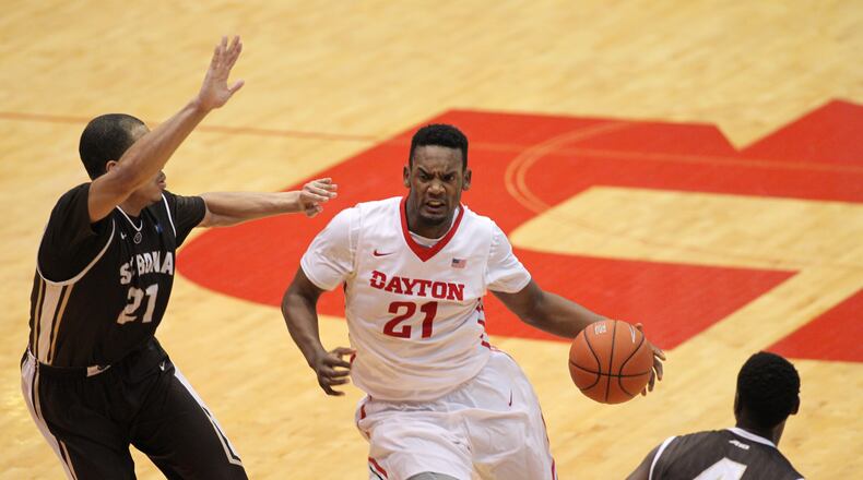 Dayton’s Dyshawn Pierre drives to the basket against St. Bonaventure’s Dion Wright on Saturday, Feb. 20, 2016, at UD Arena in Dayton. David Jablonski/Staff