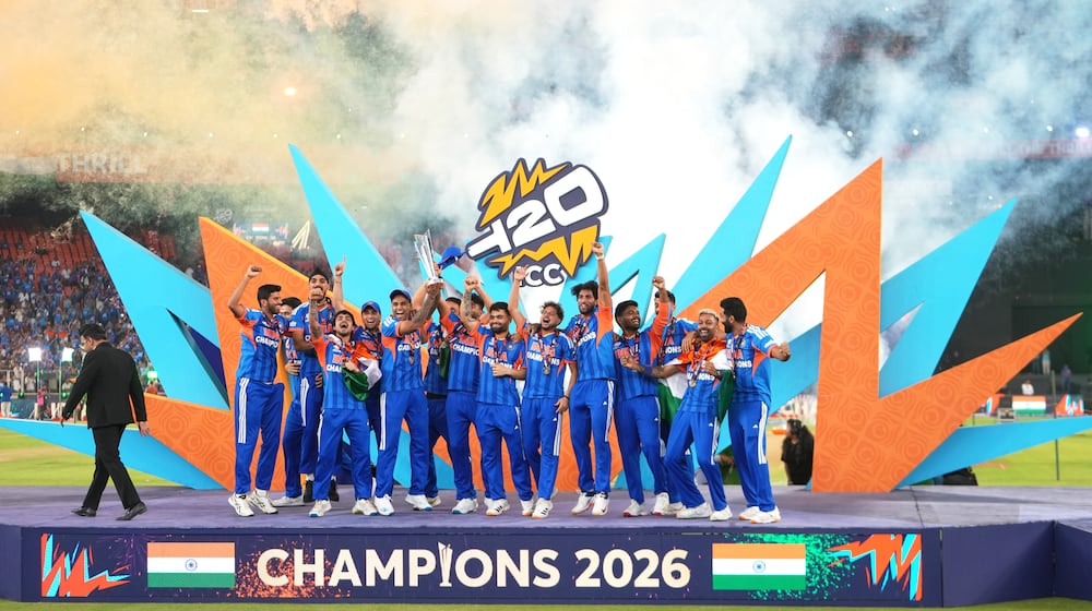 India's players celebrate with the trophy after winning the T20 World Cup final match against New Zealand in Ahmedabad, India, Sunday, March 8, 2026. (AP Photo/Ajit Solanki)