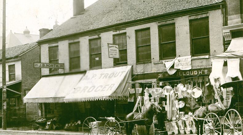 This photo from around May of 1890 shows businesses on the west side of what was still called S. Market near the corner of High Street, not long before the grand esplanade fountain, which had been dedicated the previous summer, altered the name of the street to South Fountain. Shown are Cyrus McColloughâs bargain notion shop, two groceries, those of J.B. North and A.P. Trout, and an advertisement for the upcoming performance featuring stage star Maggie Mitchell at the Grand Opera House. PHOTO COURTESY OF THE CLARK COUNTY HISTORICAL SOCIETY