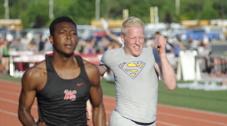 Springfield senior Jacob Yost (right) is part of Springfield’s state-qualifying 4x100-meter relay. MARC PENDLETON / STAFF