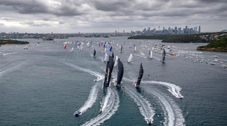In this photo provided by the Cruising Yacht Club of Australia, competitors make a start in the Sydney Hobart yacht race in Sydney, Friday, Dec. 26, 2025. (Kurt Arrigo/CYCA via AP)