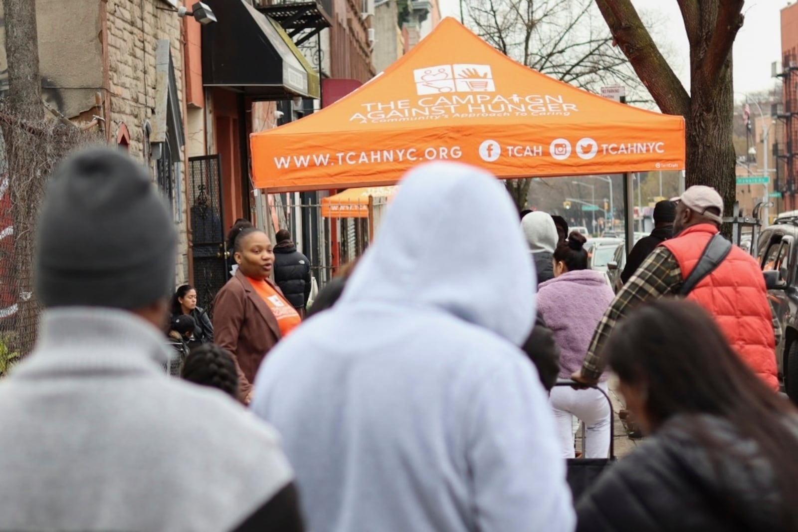 People line up for groceries outside The Campaign Against Hunger's distribution center in the Brooklyn borough of New York, Tuesday, April 15, 2025. (AP Photo/James Pollard)