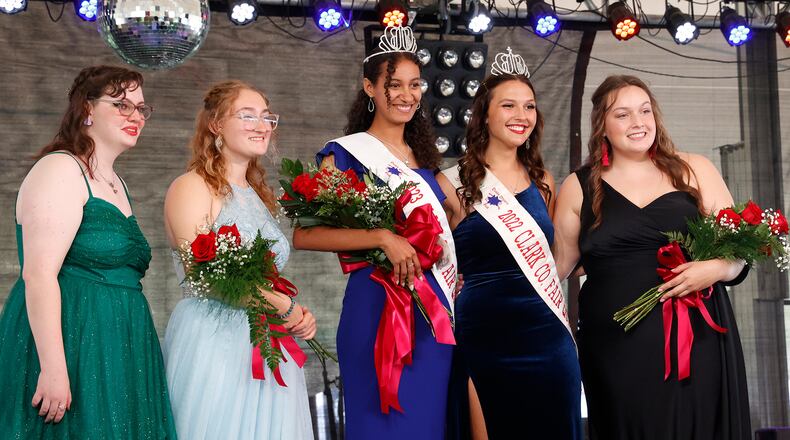 Chloe Gillaugh, the 2023 Clark County Fair Queen, is surrounded by Rebekah Hardacre, the 2022 Queen, and fellow contestants, from left, Katherine Sprowl, Brooke Comer and Megan Thatcher. BILL LACKEY/STAFF