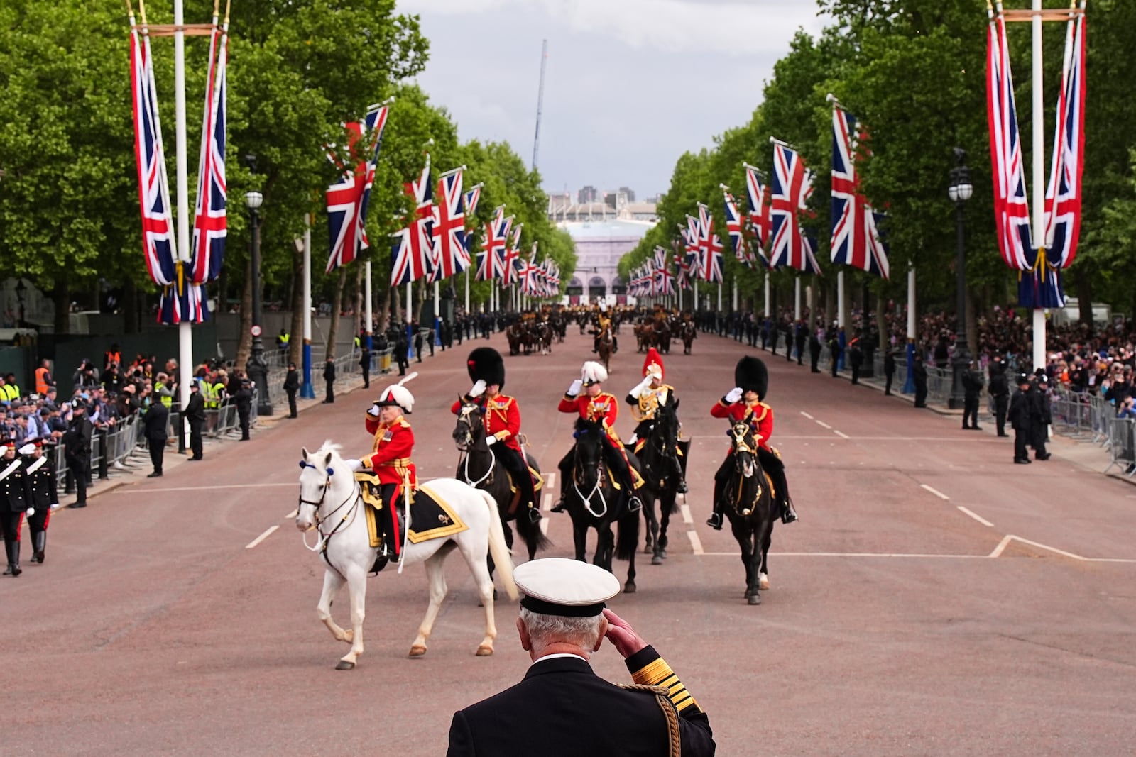 Britain's King Charles III takes the salute from the military procession marking the 80th anniversary of VE Day, in London, Monday, May 5, 2025. (Aaron Chown/Pool Photo via AP)