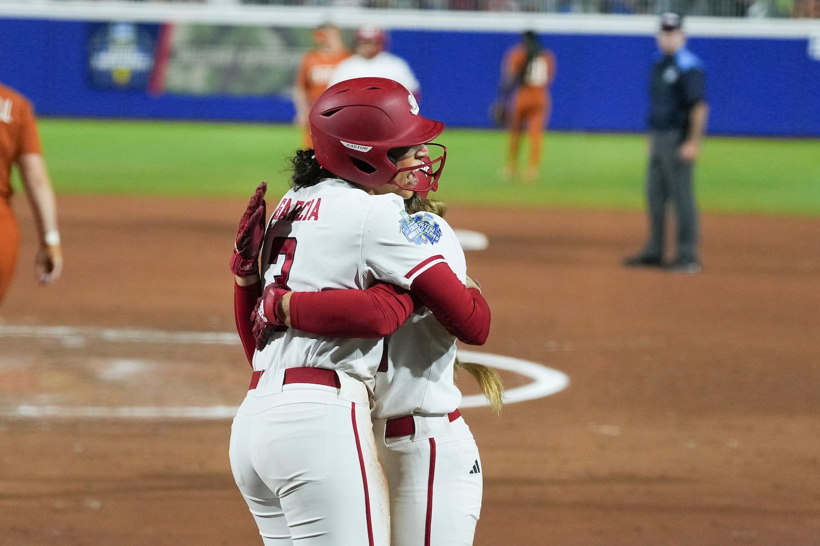 Texas Tech's Makayla Garcia, left, and Bailey Lindemuth, right, celebrate during the second game of the NCAA softball Women's College World Series finals against Texas in Oklahoma City, Thursday, June 5, 2025. (AP Photo/Kyle Phillips)
