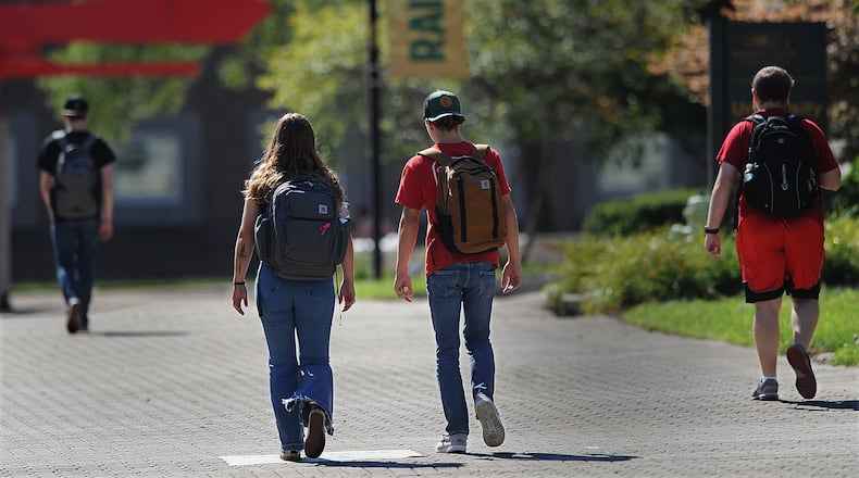 Wright State students walk to classes Wednesday Aug. 24, 2022. President Joe Biden is set to announce $10,000 federal student 
loan cancellation for many.  MARSHALL GORBY\STAFF PHOTO
