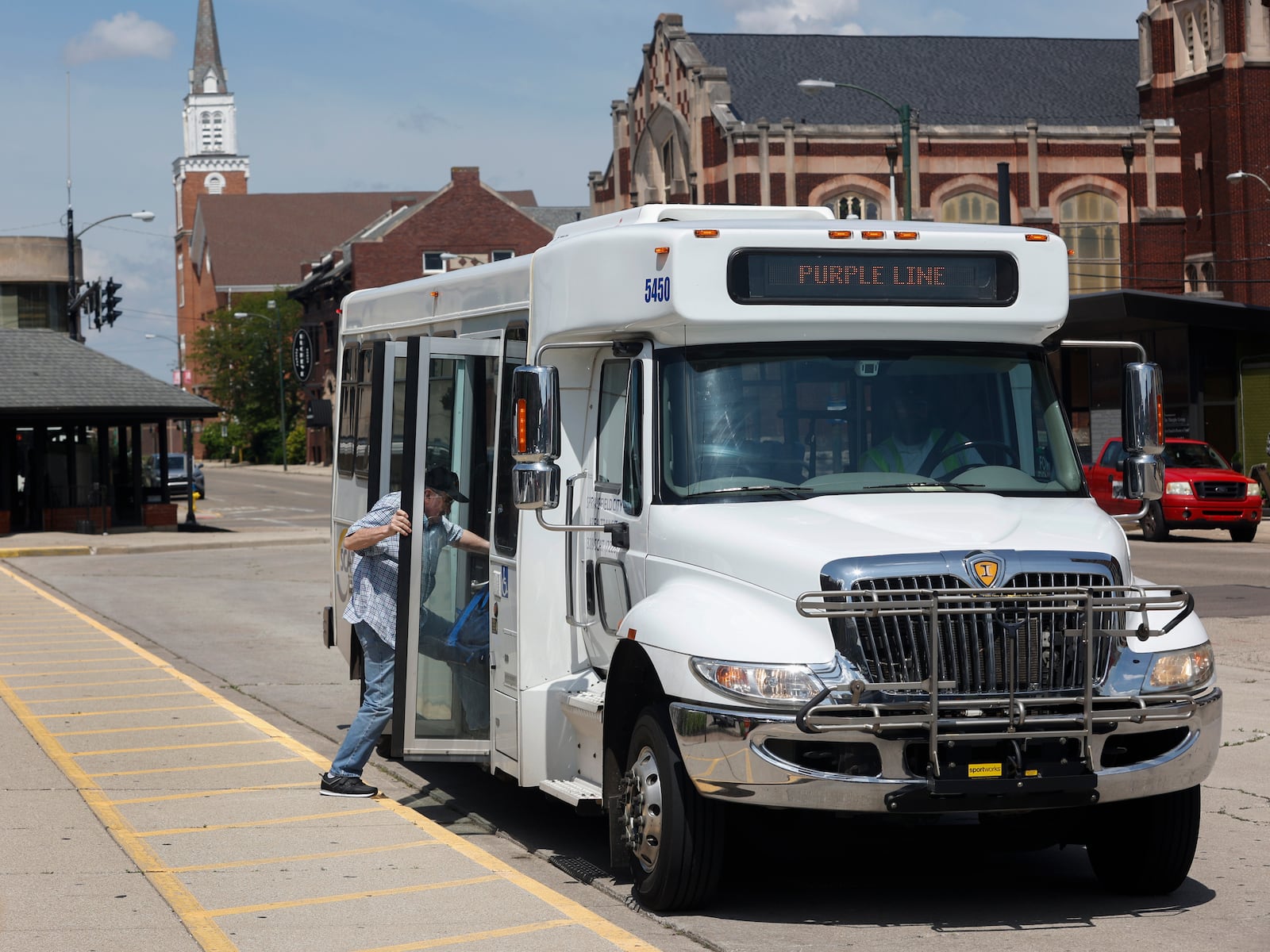 A man enters a SCAT bus on West High Street on the afternoon of Friday, June 20, 2025, in Springfield. JOSEPH COOKE/STAFF
