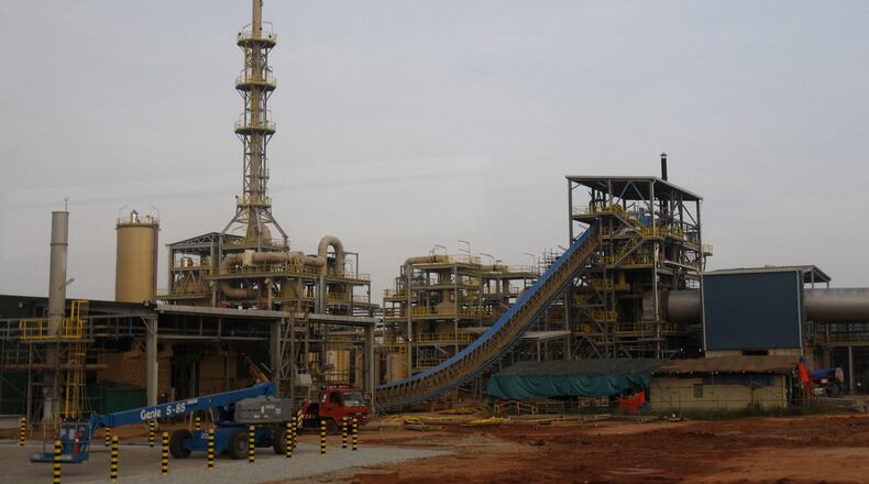 FILE - Construction vehicles are parked at the site of Lynas' rare earths plant in Gebeng, eastern Malaysia, on April 19, 2012. (AP Photo/Lai Seng Sin, File)