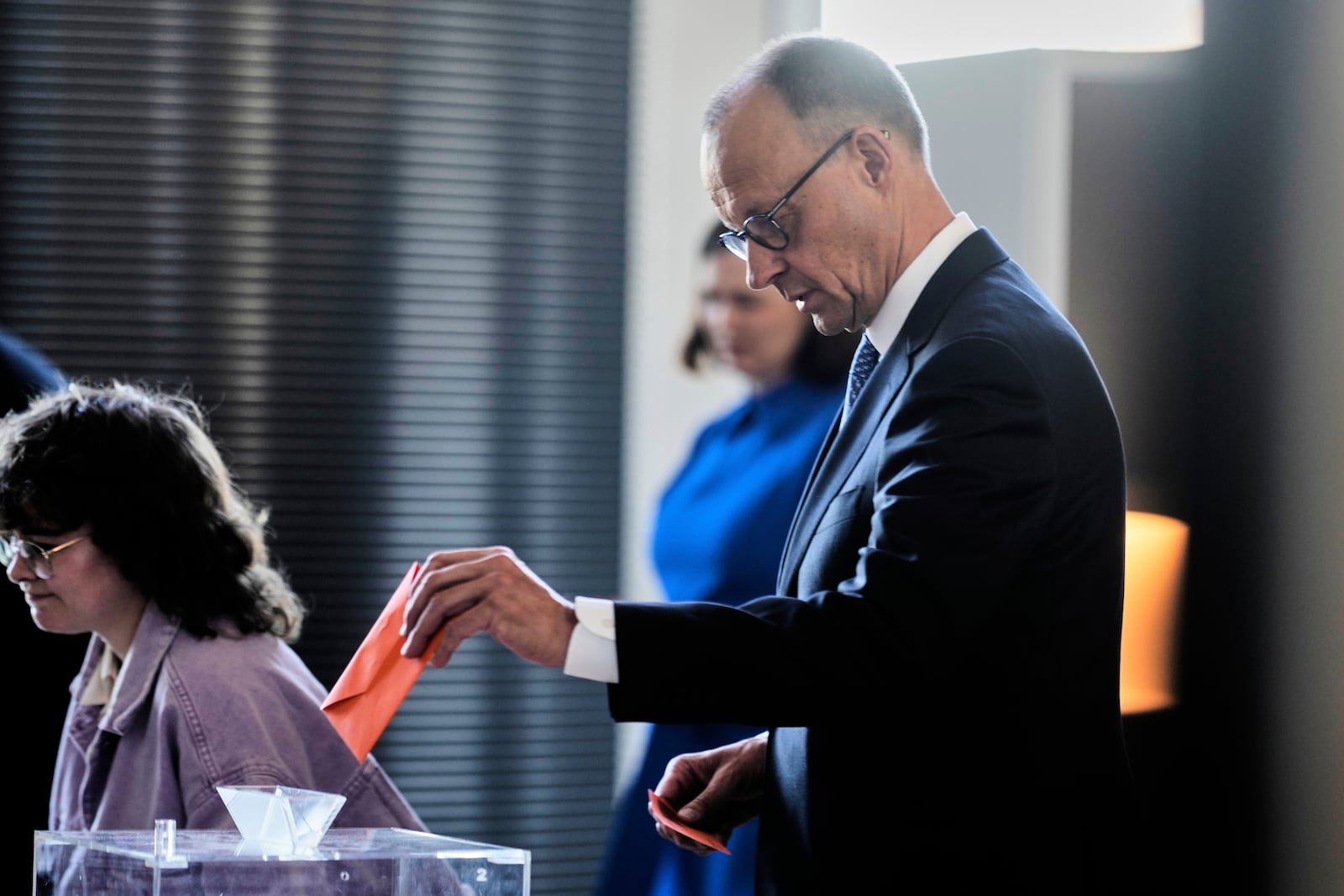 Friedrich Merz casts his vote during the election of a new Chancellor at the parliament Bundestag in Berlin, Tuesday, May 6, 2025. (AP Photo/Markus Schreiber)