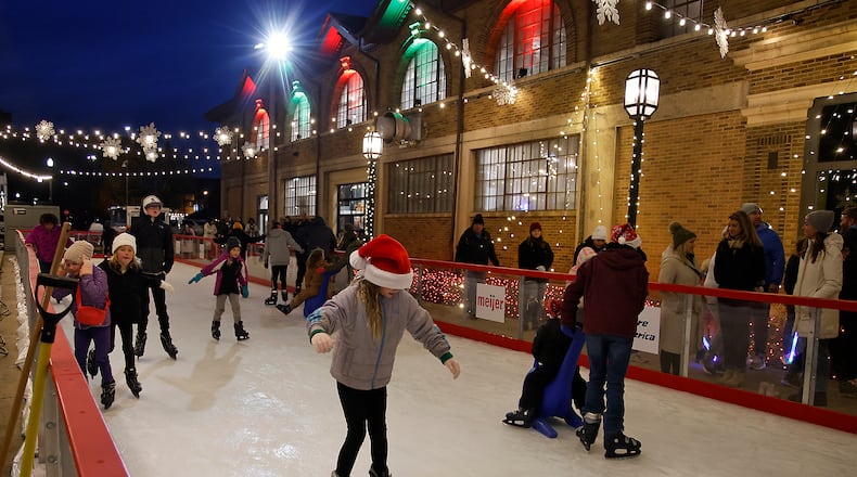 The city's outdoor ice skating rink opened for Springfield's Holiday in the City Grand Illumination Friday, Nov. 24, 2023. The annual lighting the city's Christmas tree and turning on of the holiday lights throughout downtown starts a month of activities in the downtown area. BILL LACKEY/STAFF