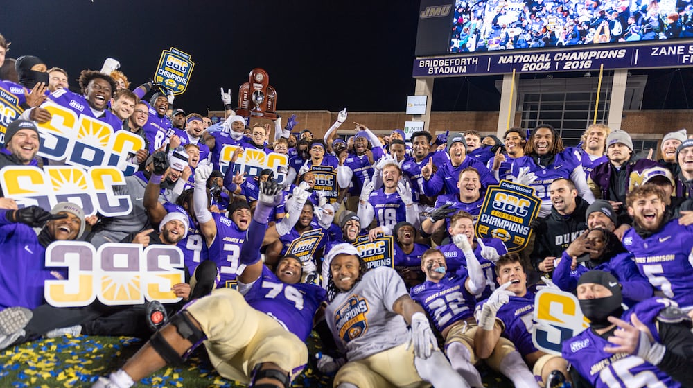 James Madison team celebrates after winning the Sun Belt championship NCAA college football game against Troy, Friday, Dec. 5, 2025, in Harrisonburg, Va. (AP Photo/Robert Simmons)